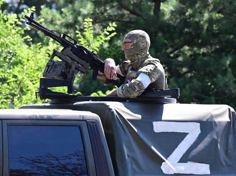A Russian serviceman patrols near the Ukrainian town of Shchastia on June 11. AFP