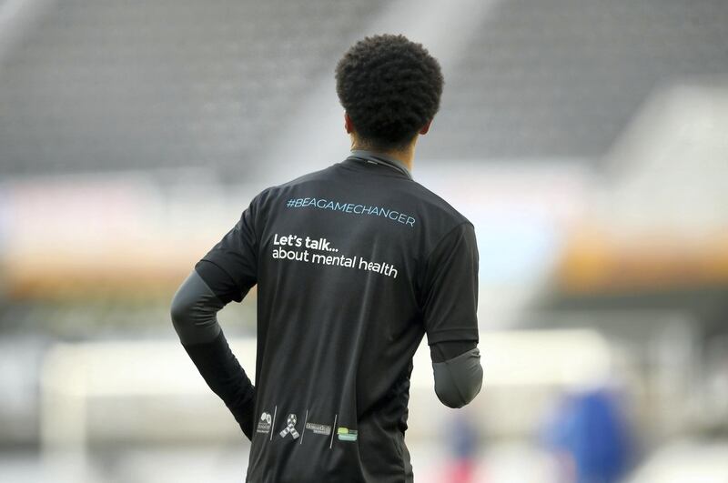 NEWCASTLE UPON TYNE, ENGLAND - NOVEMBER 21: Jamal Lewis of Newcastle United is seen wearing a Be a game changer t-shirt in support of lets talk about mental health prior to the Premier League match between Newcastle United and Chelsea at St. James Park on November 21, 2020 in Newcastle upon Tyne, England. Sporting stadiums around the UK remain under strict restrictions due to the Coronavirus Pandemic as Government social distancing laws prohibit fans inside venues resulting in games being played behind closed doors. (Photo by Alex Pantling/Getty Images)