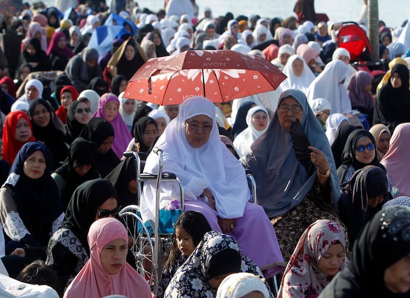 Filipinos pray during an Eid Al Adha prayer service in Zamboanga city, southern Philippines.  EPA