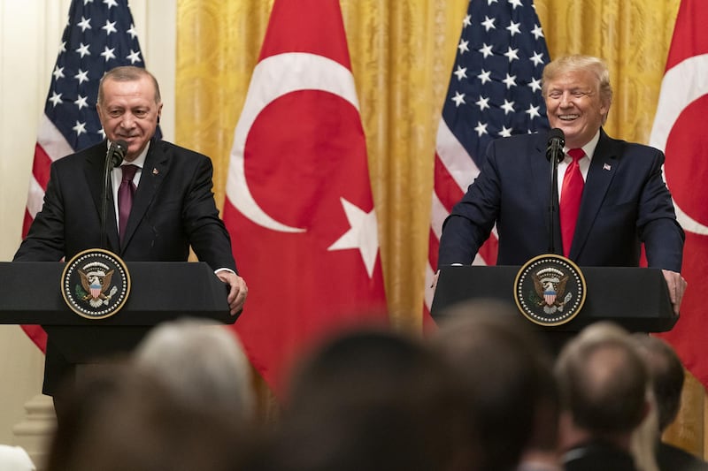 U.S. President Donald Trump and Recep Tayyip Erdogan, Turkey's president, left, react during a joint press conference at the White House in Washington, D.C., U.S. on Wednesday, Nov. 13, 2019. Trump said he'll discuss a trade deal with Erdogan during a White House meeting on Wednesday. Photographer: Alex Edelman/Bloomberg