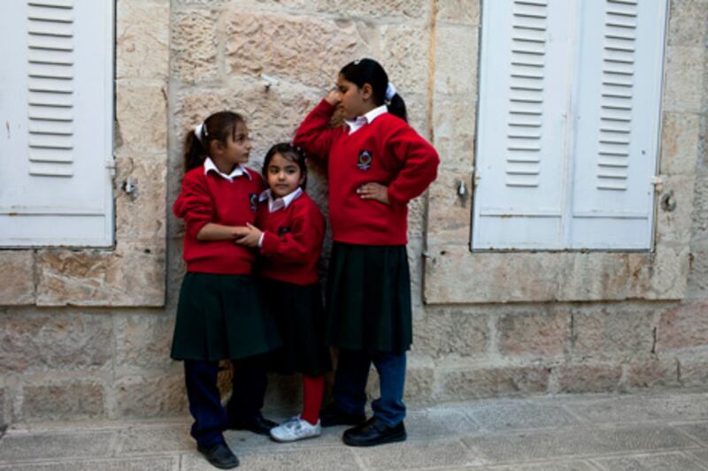 A grand building that once housed approximately 400 children is reduced to only 20 due to restrictions of access from the separation wall and checkpoints.