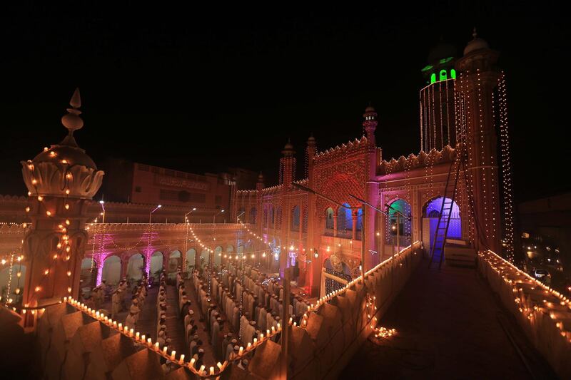 An illuminated mosque as Muslims offer special Taravih prayers at a Mosque in Peshawar, Pakistan. EPA