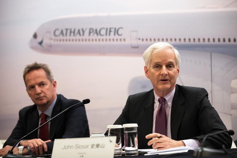 epa07433072 Cathay Pacific Airways Ltd. Chairman John Slosar, (R), and Chief Executive Officer Rupert Hogg, (L), speak during the company's annual results press conference in Hong Kong, China, 13 March 2019. The airline recorded a 293 million US dollars (HK$2.3 billion ) annual profit for 2018, reversing two straight years of losses, with the core airline business making a 82.16 million US dollars (HK$645 million) contribution to the upswing in fortunes.  EPA/JEROME FAVRE