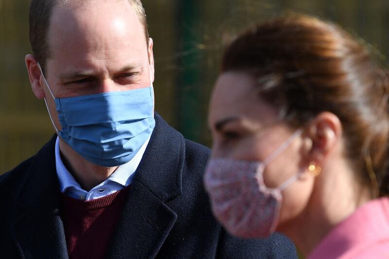 Prince William speaks to Catherine, Duchess of Cambridge, during the visit to School21. AFP