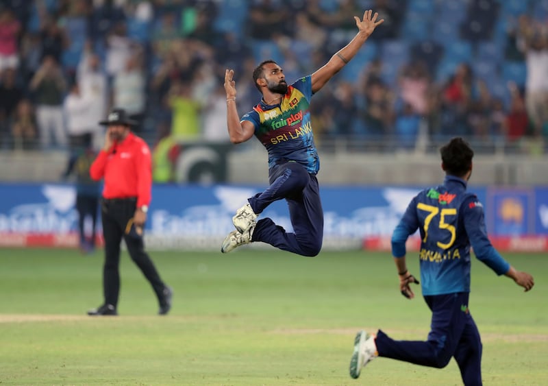 Sri Lanka bowler Chamika Karunaratne celebrates after taking the wicket of Pakistan's Haris Rauf to win the game in Dubai.
