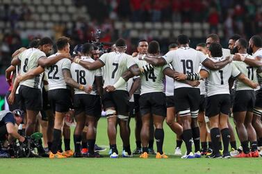 The Fiji players huddle following their 29-17 Rugby World Cup defeat against Tier One Wales. Getty