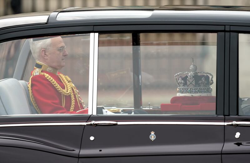 The Imperial State Crown leaves Buckingham Palace to be taken to the House of Lords. PA