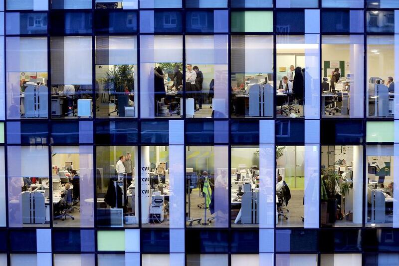 Workers in the offices of the Palestra Tower in London. Employment numbers in the United Kingdom is at a record high. Oli Scarff / Getty Images