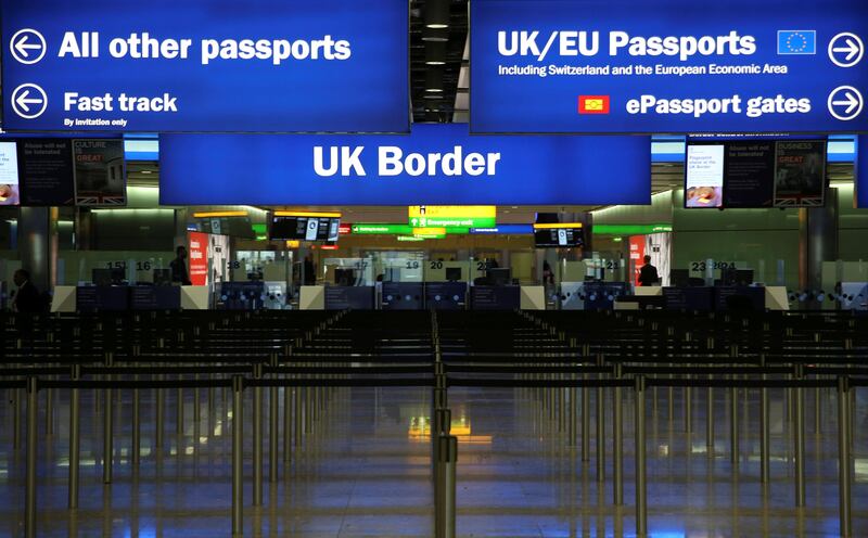 FILE PHOTO: UK Border control is seen in Terminal 2 at Heathrow Airport in London June 4, 2014.  REUTERS/Neil Hall/File Photo