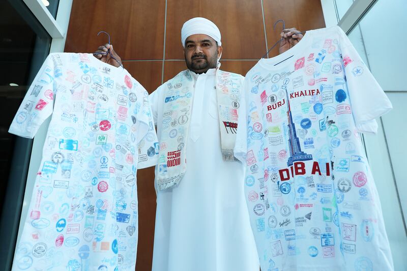 Both kandoras are covered with stamps from all of the pavilions at Expo 2020 Dubai.
