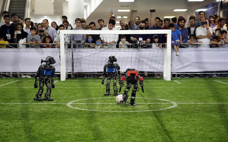 A robot football match between the Iranian MRL team, in red, and Russia's Starkit team at the 17th International Iran Open RoboCup, in Tehran. All photos: EPA