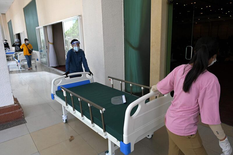 Members of the Cambodian military convert a wedding hall into a field hospital in Koh Pich, Phnom Penh, to handle a surge in Covid-19 cases. AFP