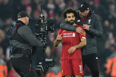 Liverpool manager Jurgen Klopp celebrates with striker Mohamed Salah after their Premier League win over Manchester United last weekend. AFP