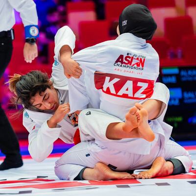 Shamma Al Kalbani, left, defeated Azhar Salykova of Kazakhstan. UAEJJF