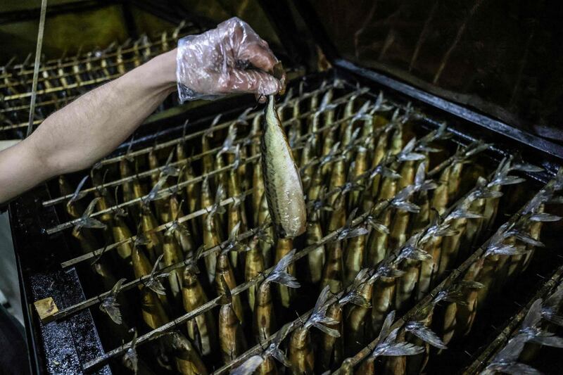 Smoked mackerels are sold at a fish market before the Eid Al Fitr holiday, in the town of Rafah, in southern Gaza Strip. AFP
