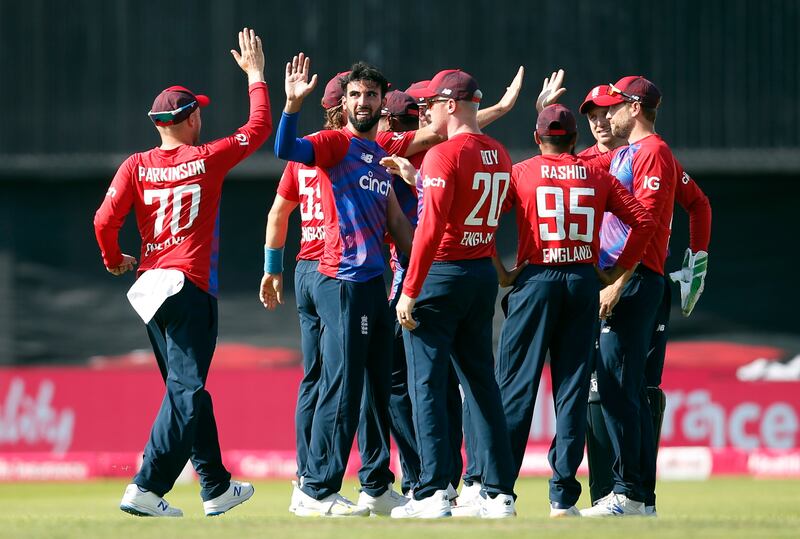 England's Saqib Mahmood celebrates with teammates after taking the wicket of Pakistan's Babar Azam during the second T20 in Leeds on Sunday