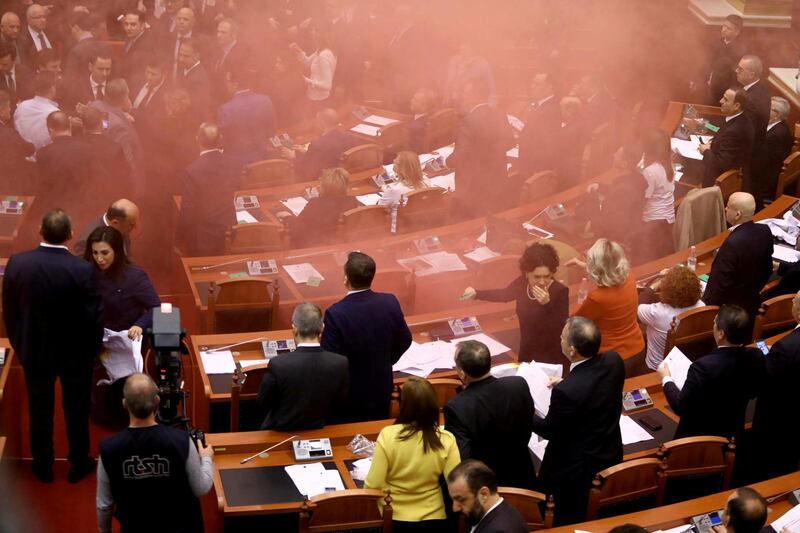 Albania's opposition lawmakers throw smoke bombs inside the Parliament during the election of the new prosecutor, in Albanian Parliament in Tirana. Reuters