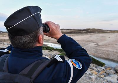 A French Gendarme on a patrol of beaches near the northern city of Calais. AFP 