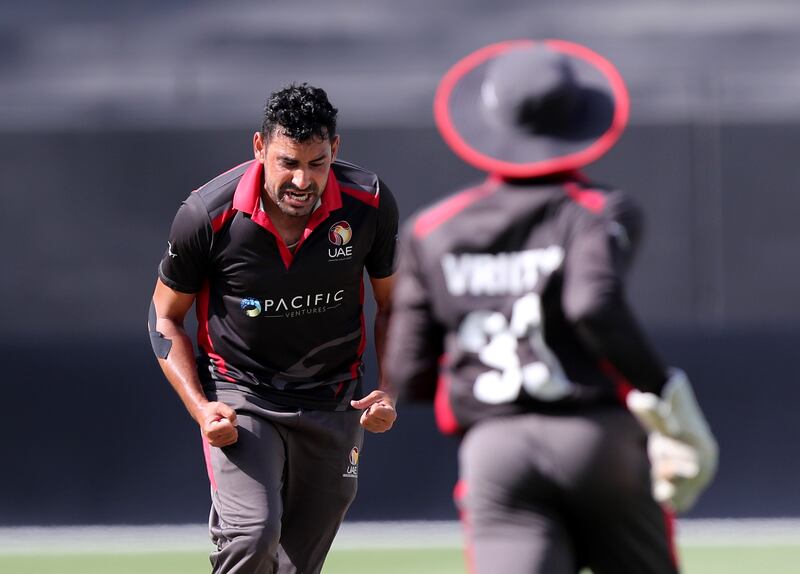 UAE's Zahoor Khan takes the wicket of Nepal's Rohit Paudel.