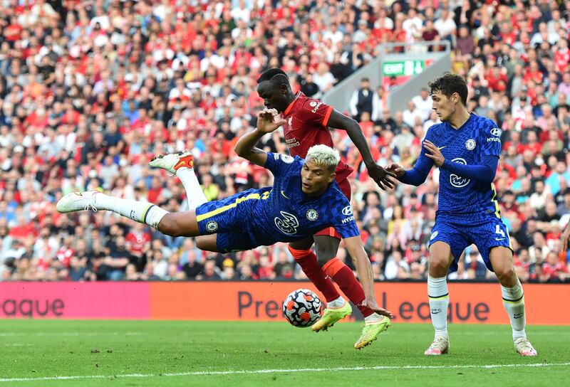 Chelsea's Thiago Silva and Andreas Christensen challenge Liverpool's Sadio Mane during the Premier League match at Anfield. Reuters