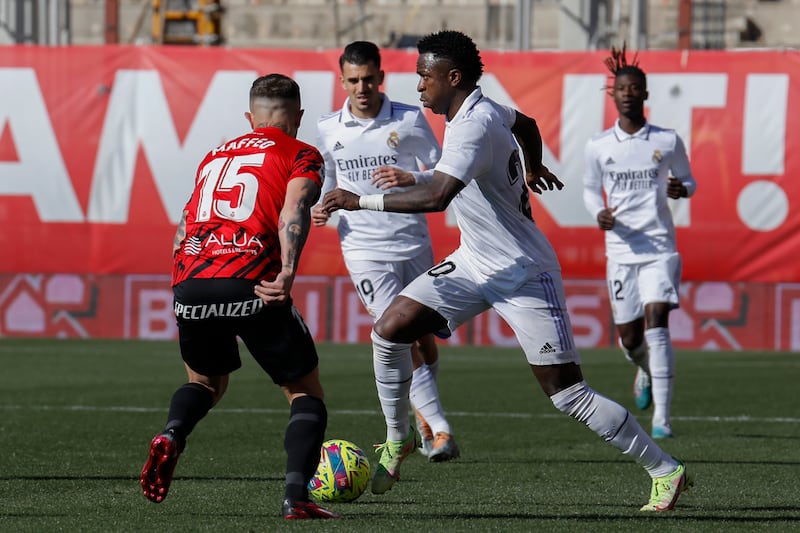 Real Madrid's Vinicius Junior in action against Mallorca's Pablo Maffeo. AP