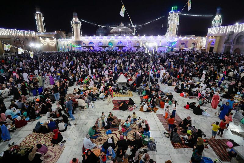 Iraqi Sunnis gather at the shrine of Sheikh Abdul Qadir Al Kilani in Baghdad. AFP