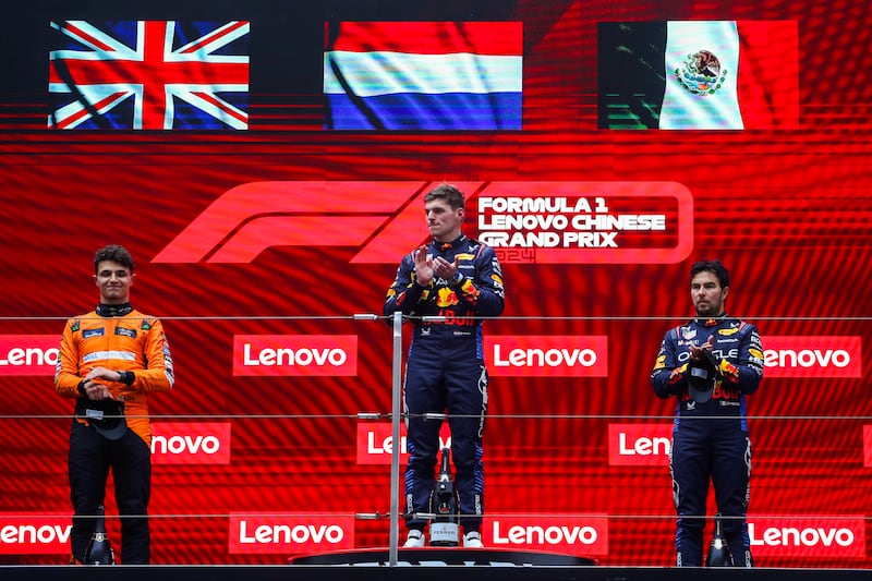 Race winner Max Verstappen alongside teammate Sergio Perez, right, who finished third, and McLaren's Lando Norris who was second. Getty Images