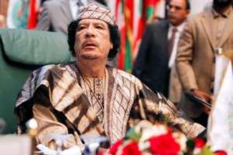 Libya's leader Muammar Gaddafi sits during the closing session of the 23rd Arab League summit in Sirte March 28, 2010.  REUTERS/Zohra Bensemra (LIBYA - Tags: POLITICS) *** Local Caption ***  ZOH18_LIBYA_0328_11.JPG *** Local Caption ***  ZOH18_LIBYA_0328_11.JPG