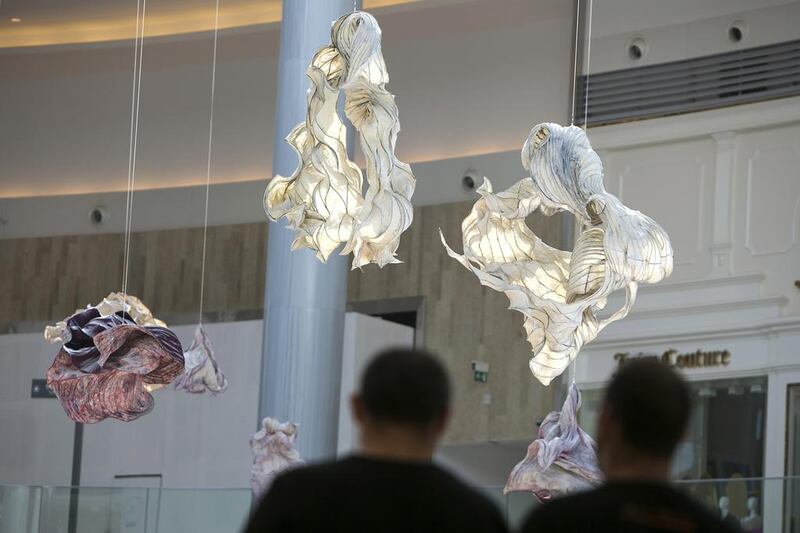 Decorative sculptures hang in the air as people browse the newly opened Yas Mall. Silvia Razgova / The National