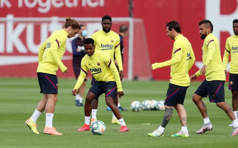 Ansu Fati, Samuel Umtiti, Lionel Messi and Arturo Vidal attending a training session at the Ciutat Esportiva Joan Gamper. AFP