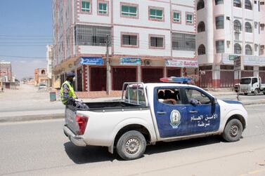 A police vehicle patrols a street after a curfew was declared in Al Sheher, a town in Yemen's Hadramawt province where the country's first coronavirus case was confirmed on April 10, 2020. Reuters