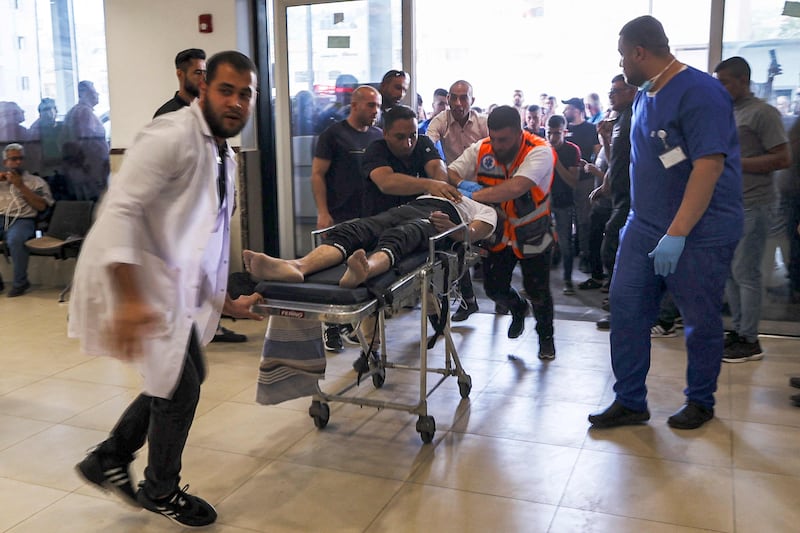 Paramedics attend to an injured man at a hospital in Jenin. AFP