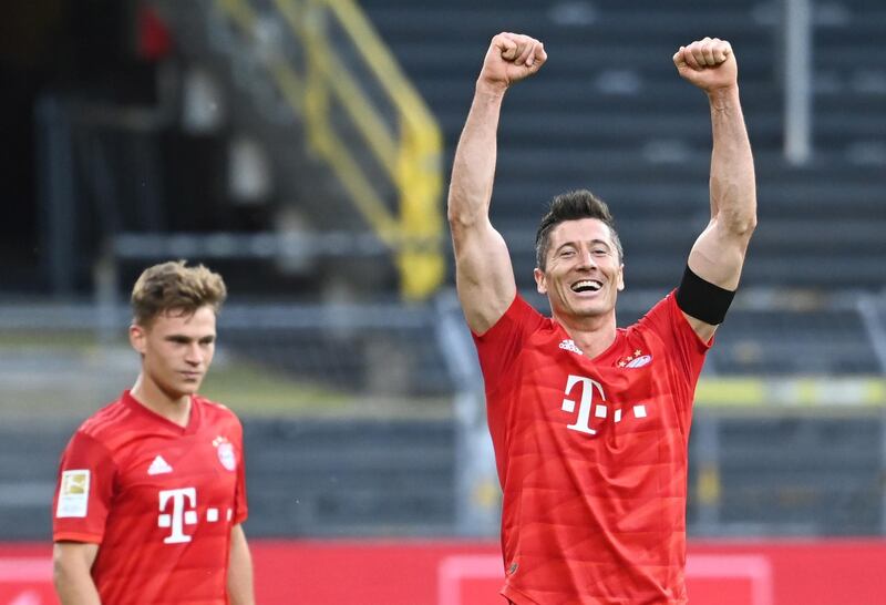 Bayern Munich's Robert Lewandowski, right, and Joshua Kimmich celebrate after the 1-0 victory. EPA