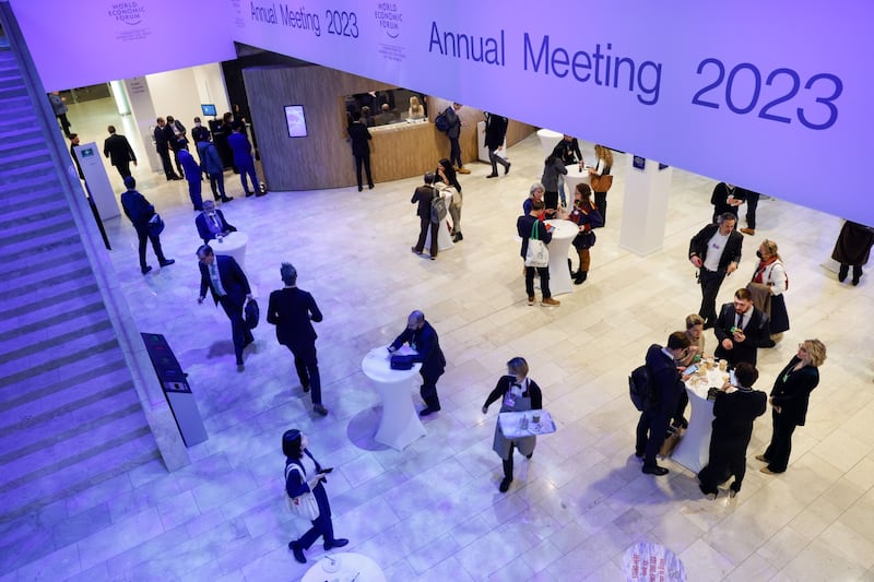 Delegates visit the refreshments area between sessions in Davos. Bloomberg
