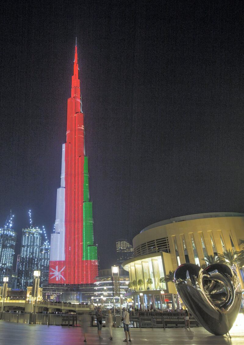 Dubai, United Arab Emirates- Burj Khalifa with the Omani flag for the Omani national day.  Leslie Pableo for The National
