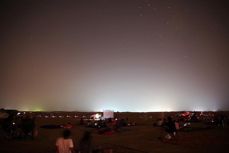 DUBAI, UNITED ARAB EMIRATES , August 13 – 2020 :- People watching the Perseid meteor shower at the Al Qudra desert area in Dubai. The event was organized by Dubai Astronomy Group with all the precaution against Covid 19 such as safe distance between the families and mask was mandatory. The event started on August 12 at 10pm to 2am on August 13.  (Pawan Singh / The National) For News/Standalone/Online/Instagram/Big Picture