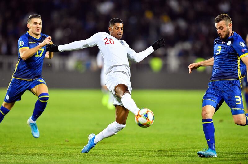 England's Marcus Rashford controls the ball. EPA