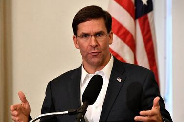 Defence Secretary Mark Esper spoke to reporters on a military flight. AP