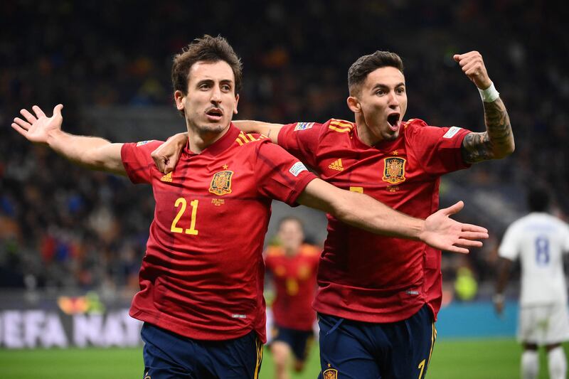 Oyarzabal (L) celebrates with forward Yeremi Pino. AFP