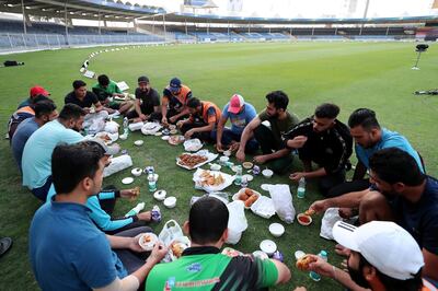 Players breaking their fast before the start of Sharjah Ramadan Cup final at Sharjah International Cricket Stadium in Sharjah on April 7,2021. Pawan Singh / The National. Story by Paul