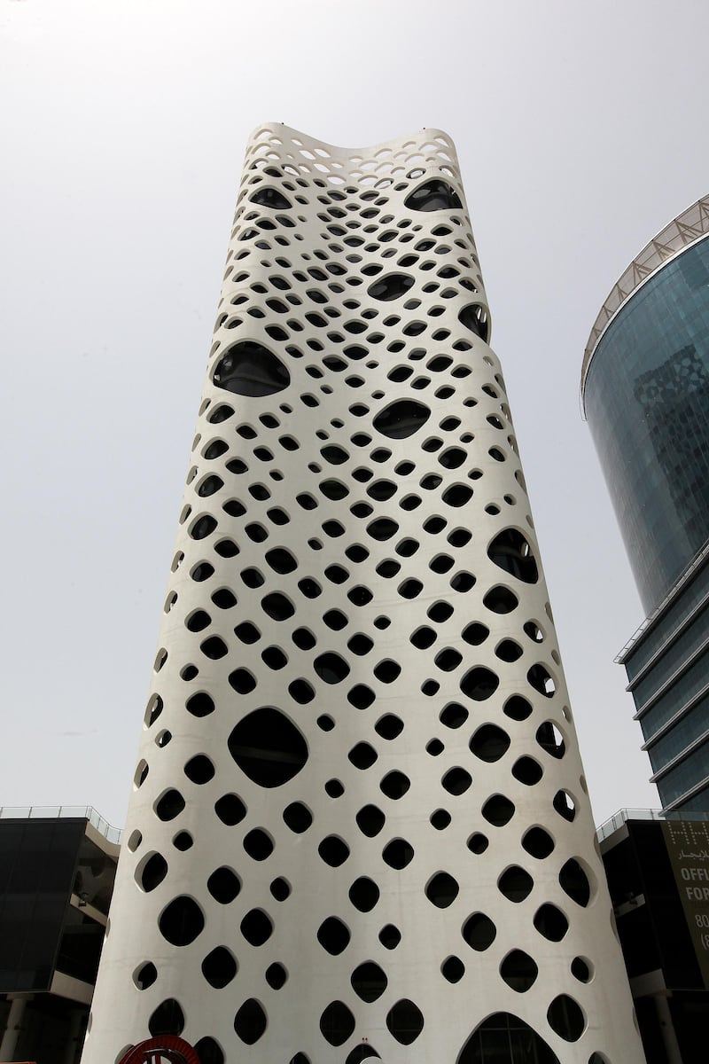   
DUBAI, UNITED ARAB EMIRATES Ð May 4, 2011: Exterior view of the O14 tower at the Business Bay in Dubai. (Pawan Singh / The National) For Business. Story by Kevin Brass The O-14 tower, dubbed the  Swiss Cheese Building. O-14, a twenty-two storey tall commercial tower perched on a two-storey podium in the heart of Dubai's Business Bay, comprises 300,000 square feet and is a collaboration between RUR Architecture of New York and the Creek Side Development Company of Dubai. For a Sector by Kevin Brass