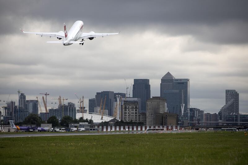 A CS100 passenger aircraft, manufactured by Bombardier Inc., operated by Deutsche Lufthansa AG's Swiss International unit, takes off at London City Airport (LCY) in London, U.K., on Tuesday, Aug. 8, 2017. Swiss began operating the commercial flights of the CS100 to LCY after Bombardier was awarded steep approach certifications by the European Aviation Safety Agency (EASA) following demonstration flights in March, according to a statement on the jet manufacturers website. Photographer: Simon Dawson/Bloomberg