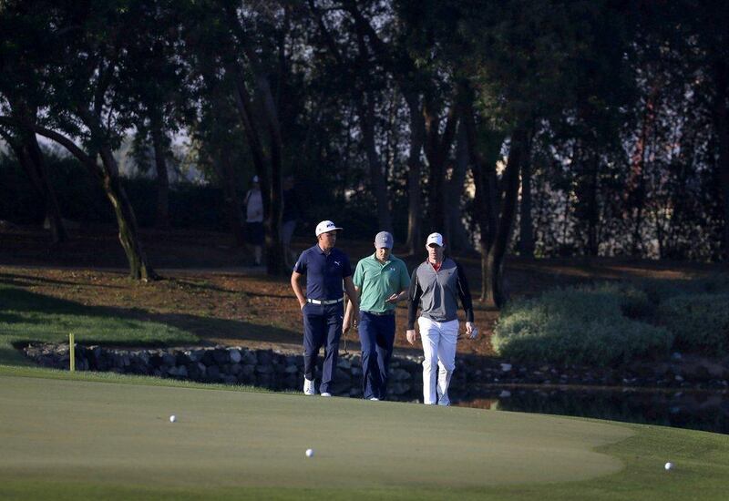 Rickie Fowler, Rory McIlroy and Jordan Spieth walk to the green during the first round of the Abu Dhabi HSBC Golf Championship on Thursday. Karim Sahib / AFP / January 21, 2016