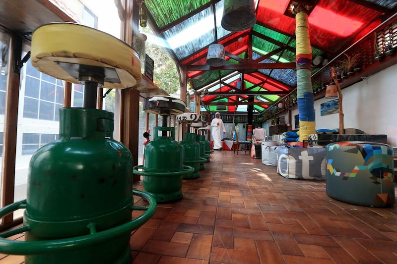 Empty gas cylinders converted to barstools are part of the decor at the Art House Cafe in the Khalidiyah area of Abu Dhabi. Ravindranath K / The National