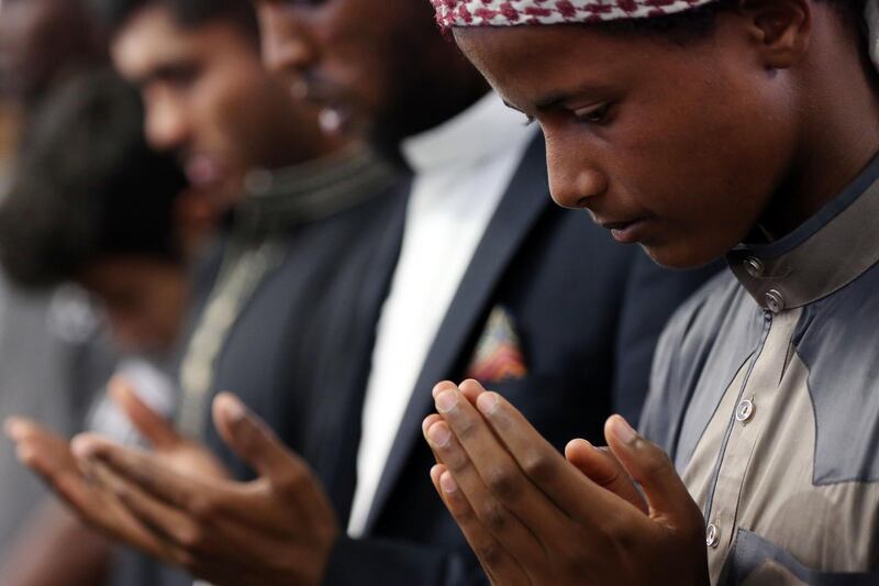 Youths pray as they attend congregational Friday prayers at the Jamia Masjid mosque. AFP