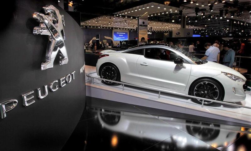Peugeot-Citroen will buy out General Motors' European Opel and Vauxhall nameplates. Yuri Kochetkov / EPA
