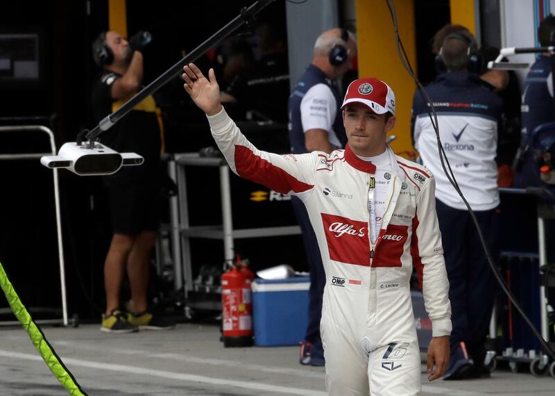 Sauber driver Charles Leclerc of Monaco waves to spectators in the pit during the qualifying session at the Monza racetrack, in Monza, Italy, Saturday, Sept. 1, 2018. The Formula One race will be held on Sunday. (AP Photo/Luca Bruno, Pool)