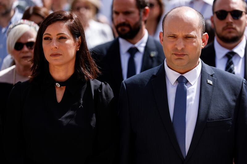 Israeli Prime Minister Naftali Bennett and his wife, Gilat, take part in the ceremony marking Holocaust Remembrance Day at Warsaw Ghetto Square at the Yad Vashem memorial in Jerusalem. AP