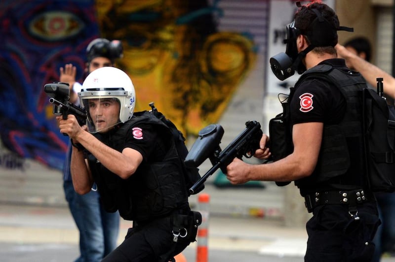 Turkish riot police fire rubber bullets to disperse protesters during a demostration in Istanbul on July 24. Turkey detained hundreds of people in coordinated nationwide dawn raids against suspected militants and Kurdish militants following a wave of deadly violence in the country, the prime minister's office said. AFP Photo