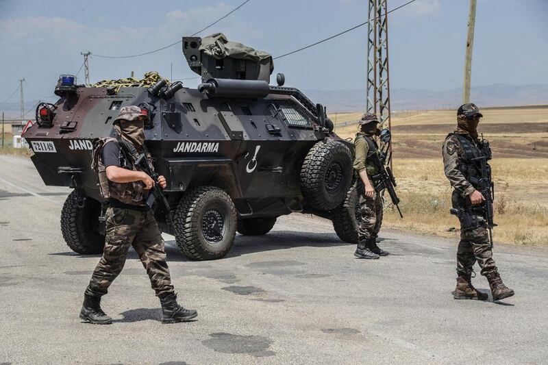 Turkish gendarmes block the road at a military checkpoint in Diyarbakir, south-east Turkey, during 2016 operations against the PKK. AFP / Ilyas Akengin